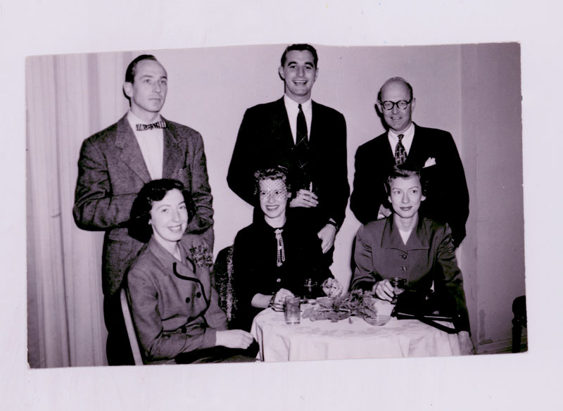 Marilyn (seated right) and Hearst co-workers at a holiday party