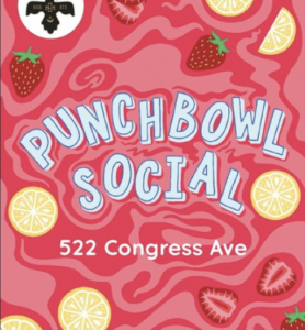 Blue letters spelling out 'Punchbowl Social' swirl in a red juice with lemons and strawberries.